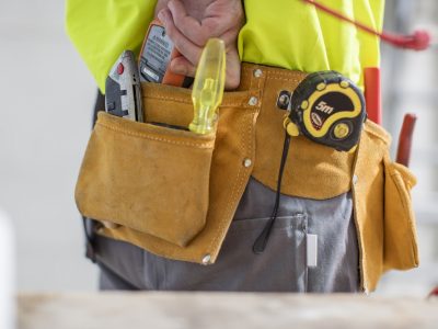 Close-up of construction worker with tool belt